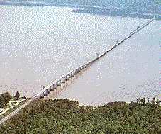 graphic-long bridge over water connecting two distant shores